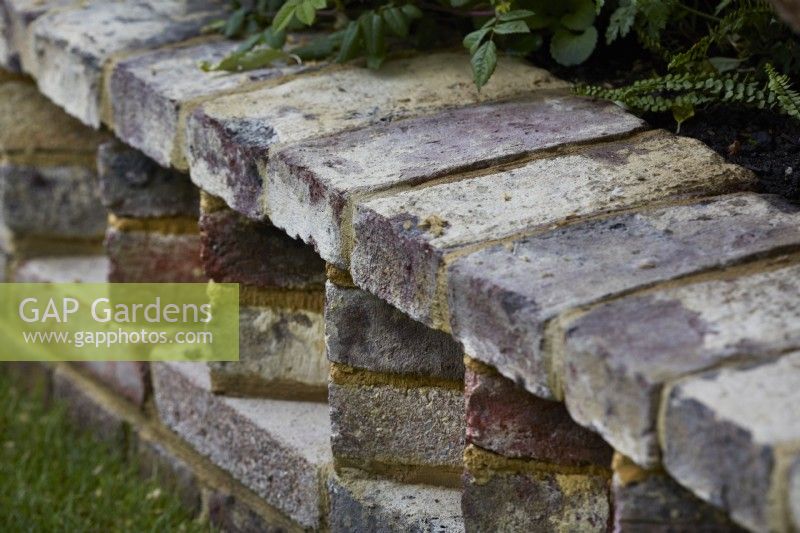 Detail of wall built with handmade low carbon bricks.