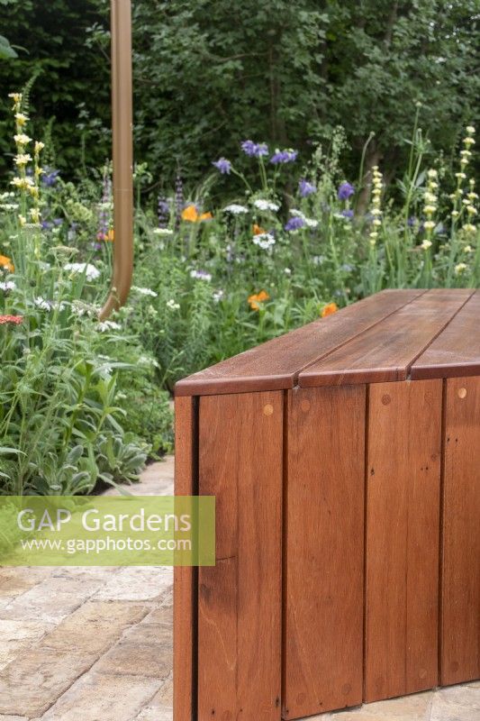 A contemporary bench made from repurposed timber cladding on The Sadler's Wells East Garden, designed by Alexa Ryan-Mills - All About Plants Gardens - RHS Chelsea Flower Show 2023