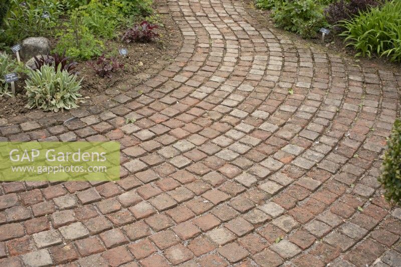 Curved paving with brick setts at Barnsdale Gardens, April