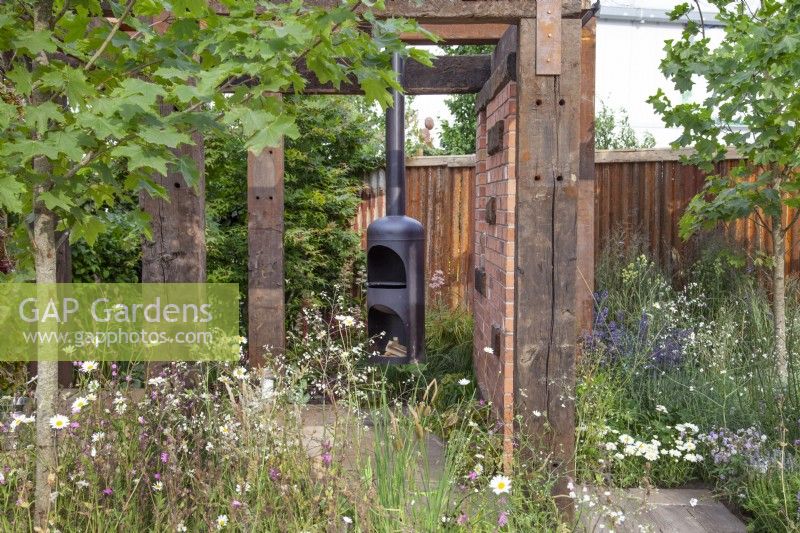 Pergola made from raw recycled materials in 'Inspiration in the Raw' garden at BBC Gardener's World Live 2018