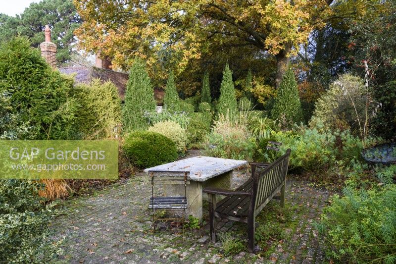 Slate table and seating in the garden of Balmoral Cottage, Kent in December