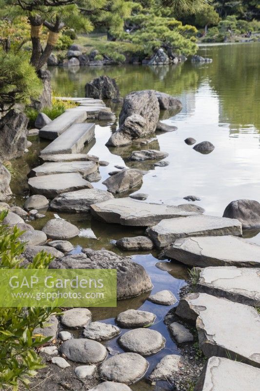 Stepping stones arranged at the lakes edge known as Iso-watari
