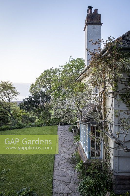 View of the house at Greencombe gardens, Devon, spring woodland garden