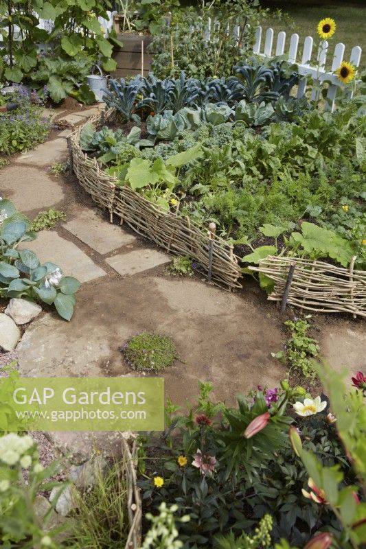 Southend City Council: The Miller's Garden. Designer: Tony Wagstaff. Vegetable patch by rustic pathway.