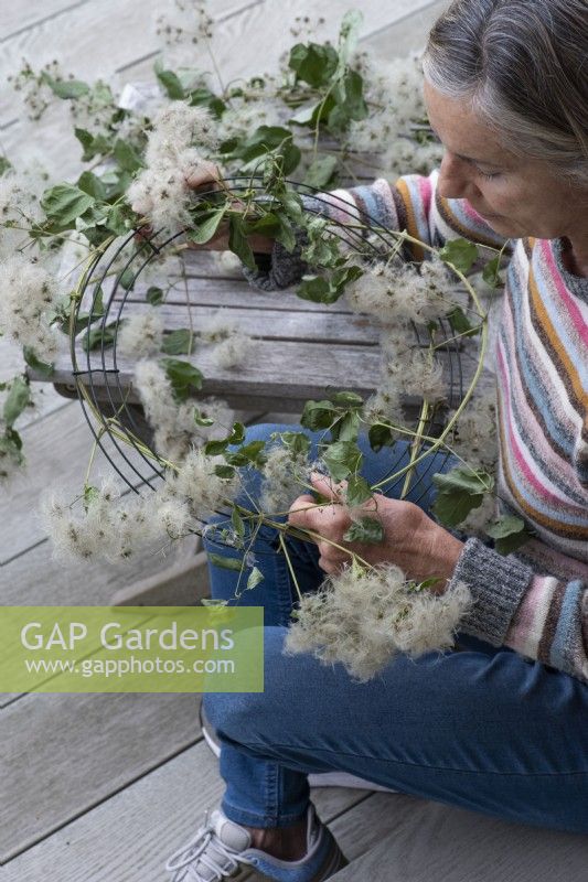 Long lengths of freshly picked, pliable old man's beard, gathered from the hedgerows, are woven round a florists' wire frame before being hung in a dry, cool place to dry for 3 weeks.