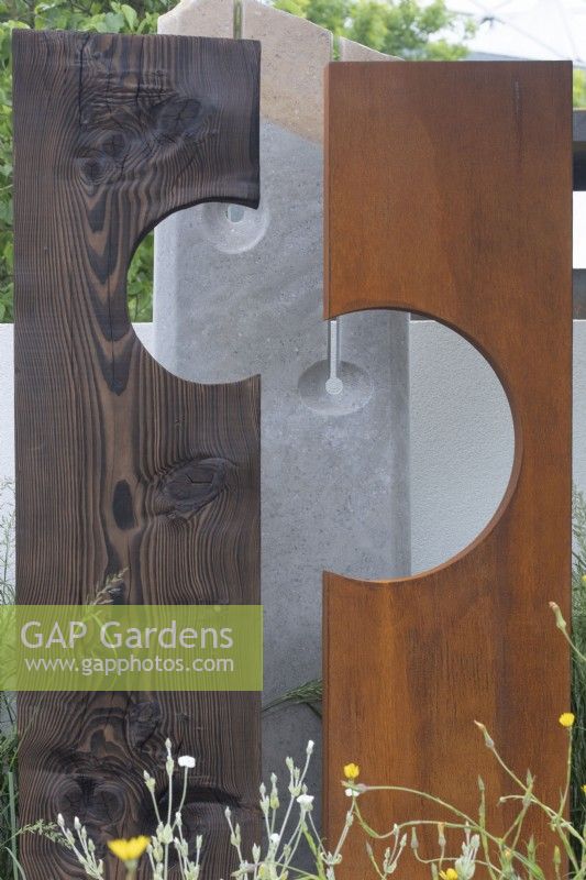 Wooden sculpture in the 'Oasis of Peace' garden at BBC Gardeners World Live 2019, June