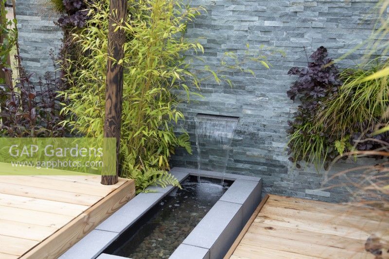 A contemporary water feature in 'Harborne Botanics garden', BBC Gardeners World Live 2019, June 