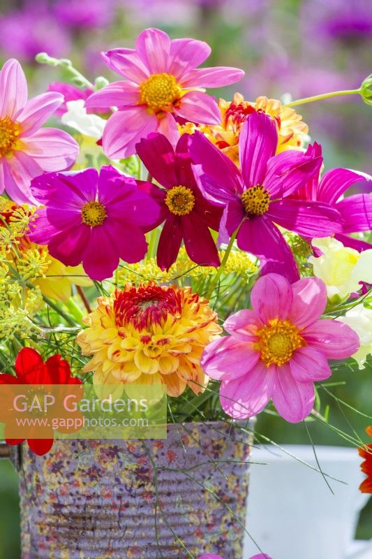 Sumer flower bouquet in tin can vase containing Cosmos, Dahlia and Fennel.