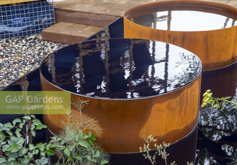 Corten steel water feature with dyed black ink
