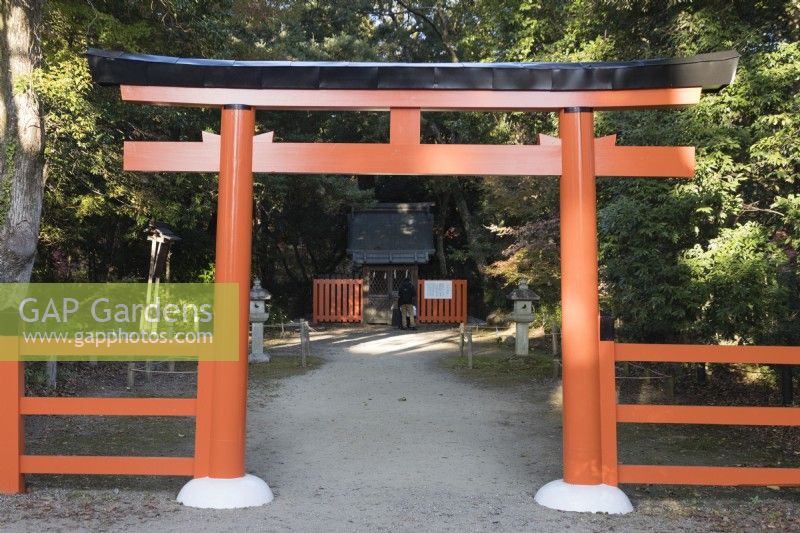 Orange painted wooden arch leading to the Nakagari shrine. 
