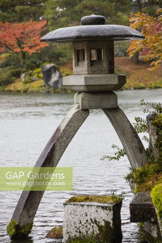 The Kotoji two-legged stone lantern at the edge of the Kasumigaike Pond. 