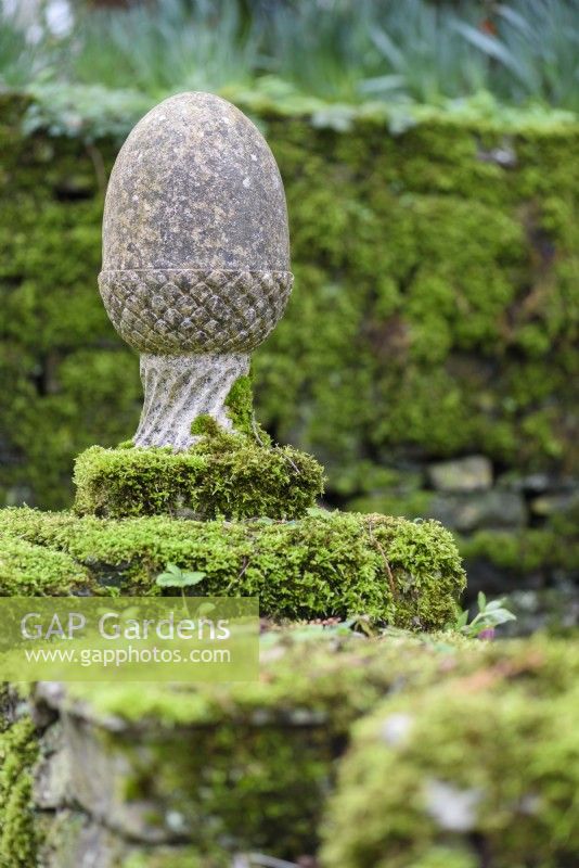 Acorn finial covered with moss