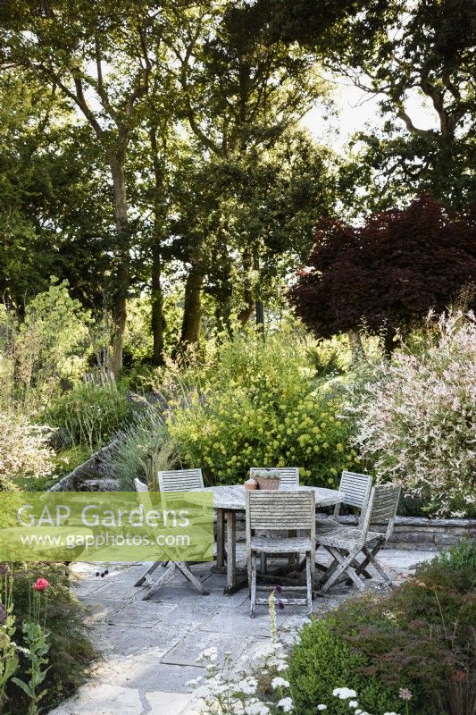 Seating area in a country garden in July