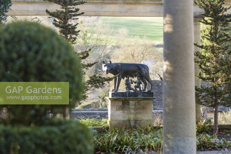 Romulus and Remus suckled by the She-Wolf framed by columns of the colonnade on the Great Terrace at Iford Manor in January