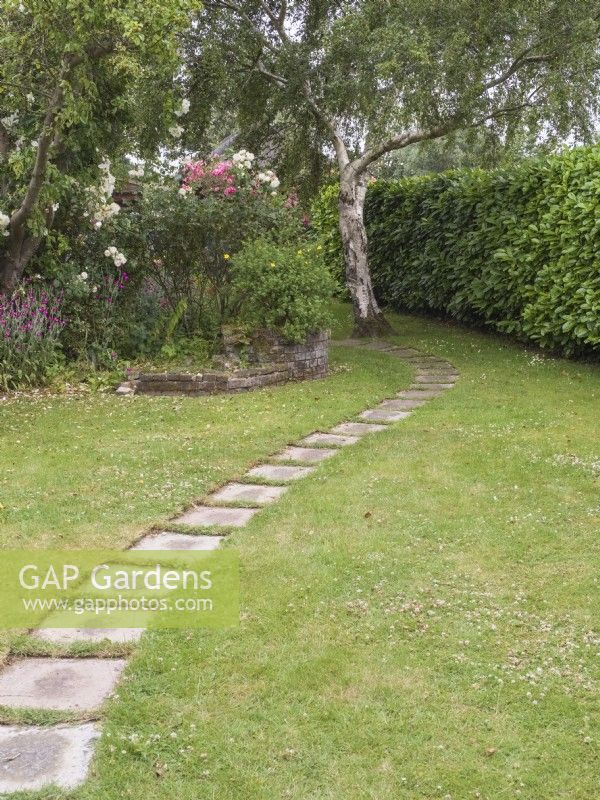 Paved garden path in lawn
