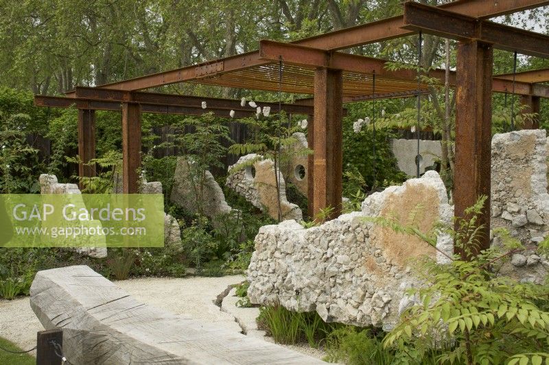 RHS Chelsea Flower Show 2023 - Concrete panels suspended in a steel pergola - Samaritans' Listening Garden designed by Darren Hawkes