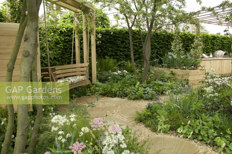 RHS Chelsea Flower Show 2023 - Swing overlooking the London Square Community Garden Designed by James Smith