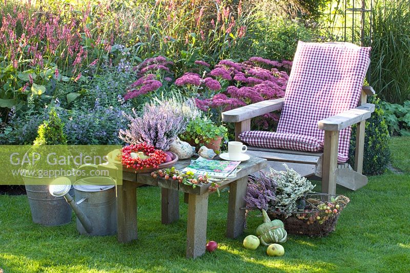 Seating area, Sedum Autumn Joy, Persicaria amplexicaulis High Society, Calluna vulgaris Garden Girls 