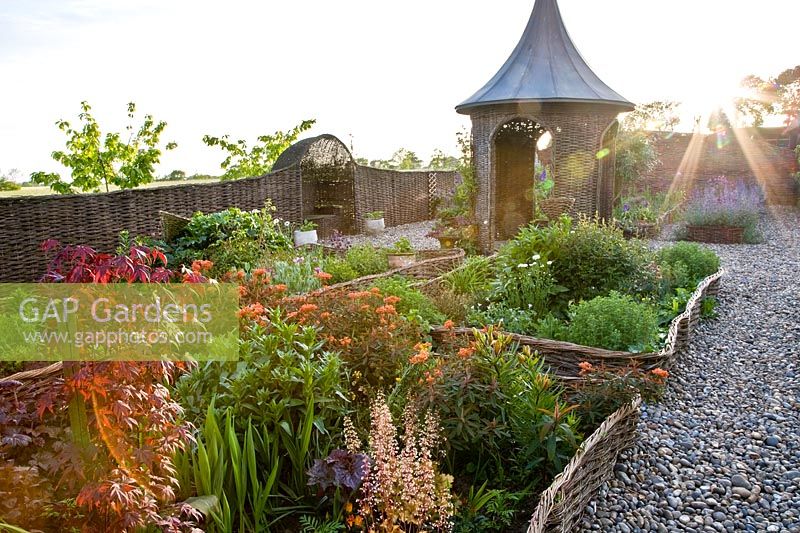 Cottage garden with pasture-edged beds 