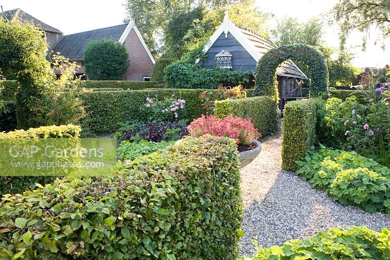 Cottage and kitchen garden in the evening light 