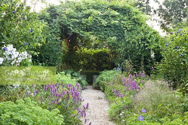 Arbor with perennial bed 