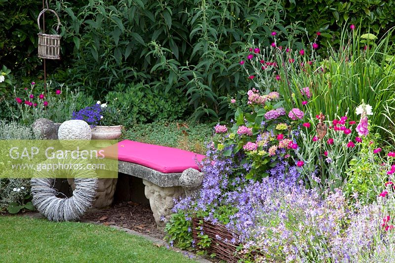 Perennials with willow border and seating area 