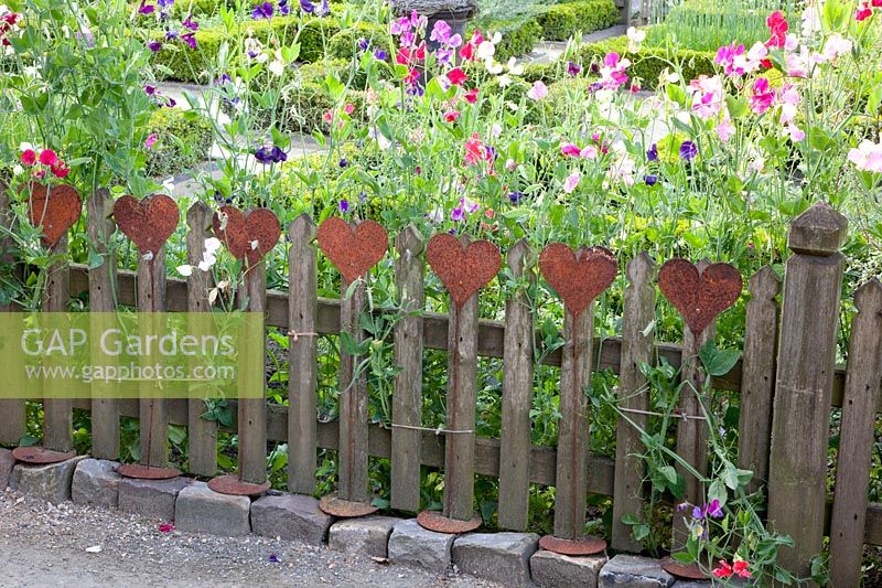 Wooden fence with hearts 