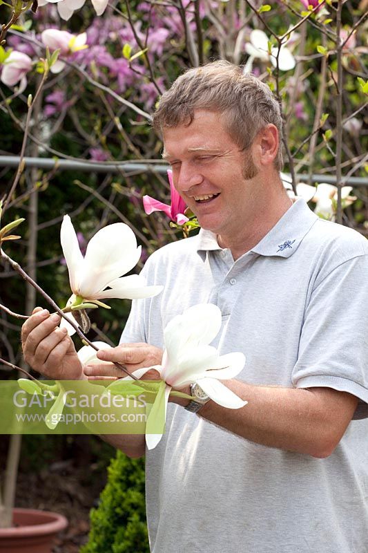 Owner, Reto Eisenhut with Magnolia Lotus 