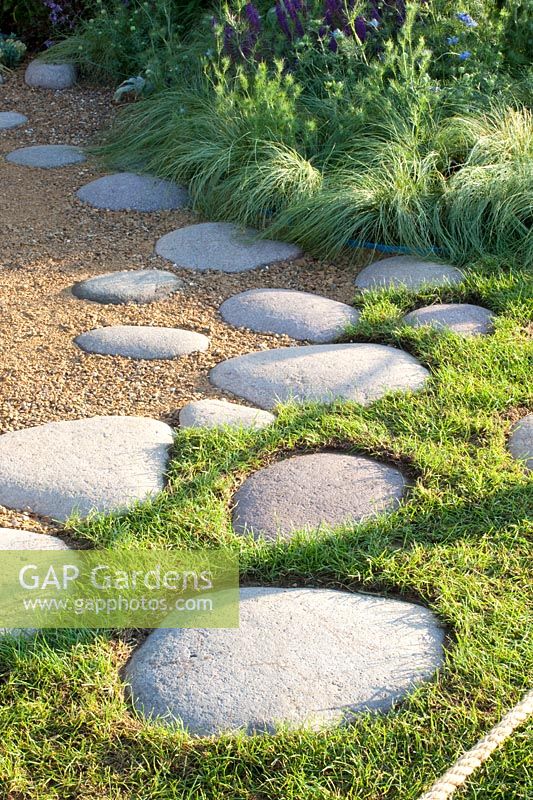 Path with stepping stones and sedge, Carex comans Amazon Mist 