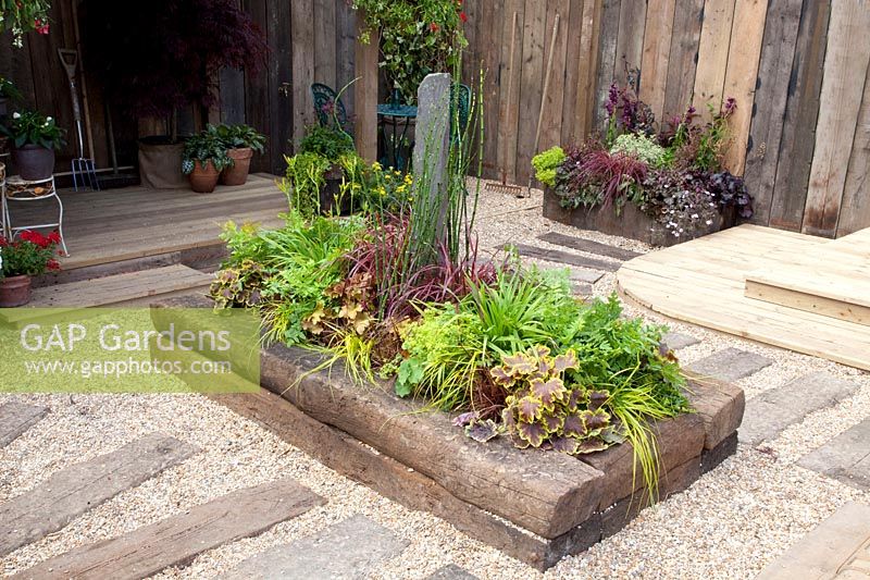Flower bed edging made from old railway sleepers 