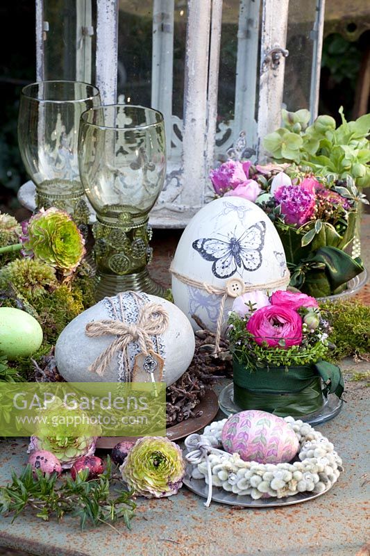 Easter decoration in vintage style, arrangement of ranunculus, willow wreath 