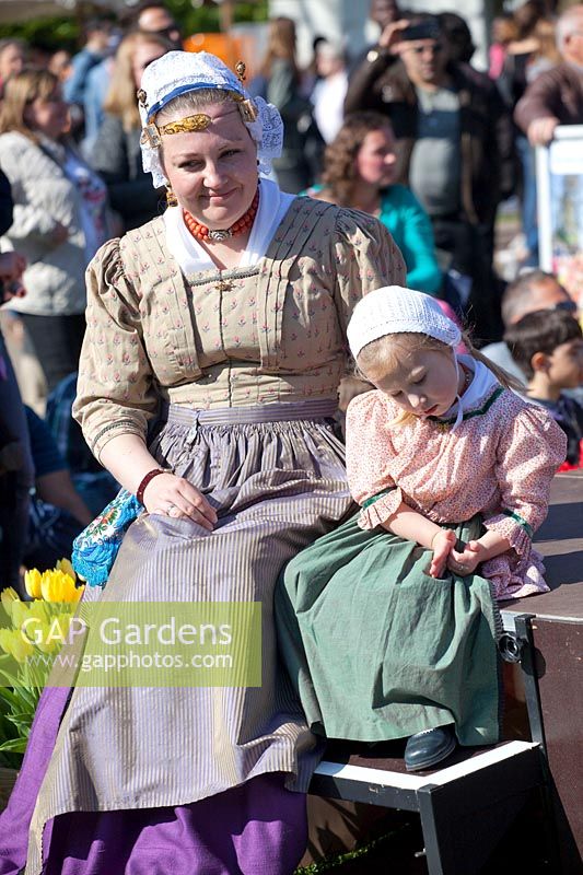 Woman with child in historical costume at Keukenhof 
