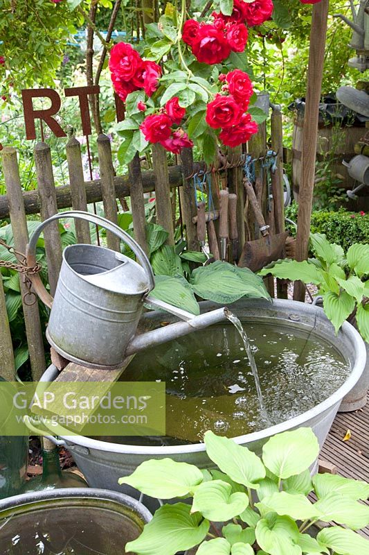 Mini pond with watering can 