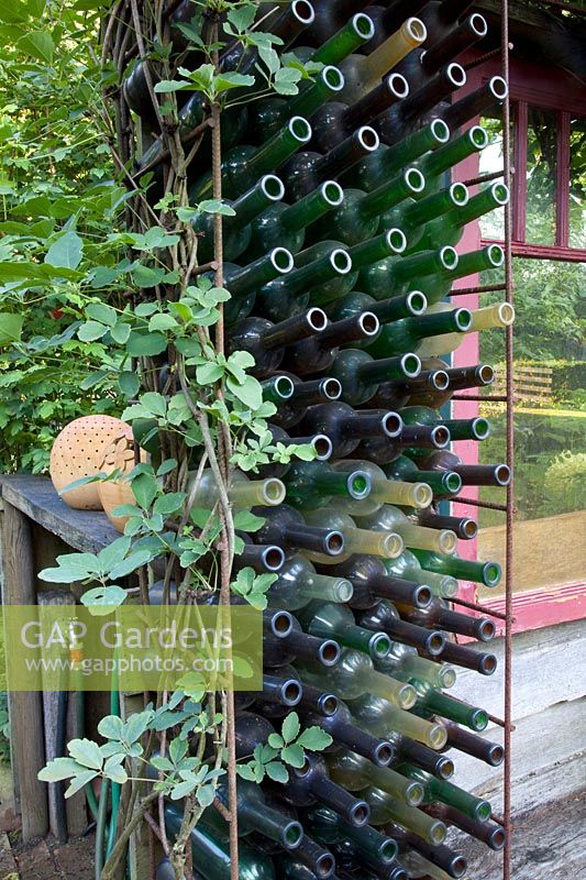 Trellis with old bottles 