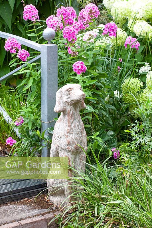Stone dog in the garden 
