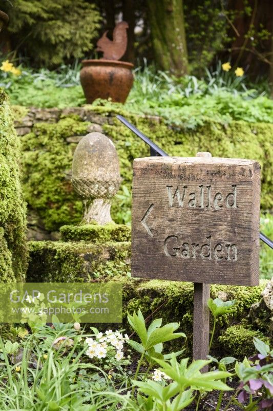 Wooden sign at Cerney House Gardens in Gloucestershire