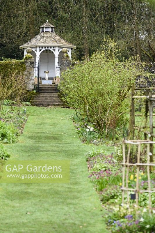 Wooden summerhouse at Cerney House Gardens in March
