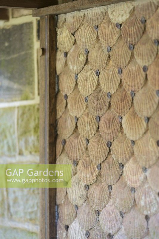 Wall of scallop shells at York Gate Garden