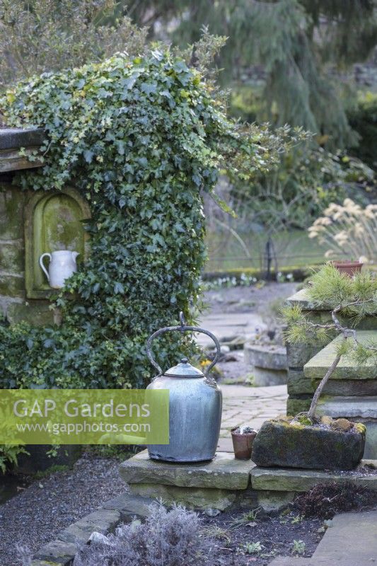 Metal kettle in York Gate Garden in February