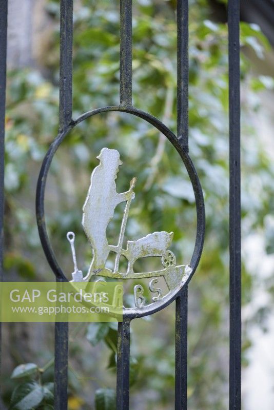 Symbol of the Gardeners' Royal Benevolent Fund, now called Perennial, in a gate at York Gate Garden