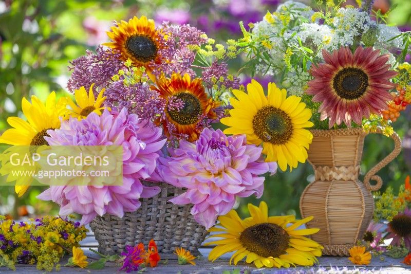 Summer flower arrangement with dahlias, eupatorium, sunflowers and wildflowers.