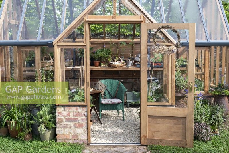 Greenhouse on the Eat, Drink and be Rosemary garden at RHS Malvern Spring Festival 2024. Designed by Laura Ashton-Phillips