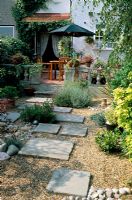 Dry gravel garden with paving slabs leading to house and patio, Glebe Way, Kent