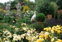 Rose garden with urns and peacock at Kettle Hill