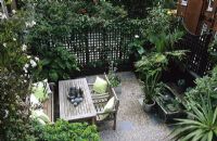Urban roof garden with trellis fencing and furniture