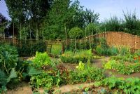 Vegetable garden with willow fencing at Pannells Ash Farm in Essex