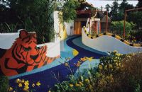 Child safe garden with decorated and painted hard surfaces.