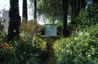 Garden at Chelsea FS 2000 with William Pye water sculpture and Cupressus sempervirens