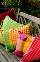 Coloured Fabric cushions (Designers Guild) on wooden bench