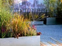 Grasses in galvanised planters - 'A Modern Roof Garden'  Hampton Court Show Garden 2003 
